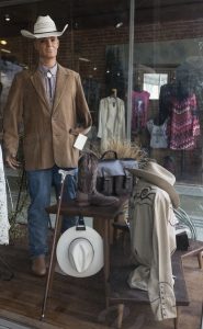 Public domain photo by Carol Highsmith of a Western Store Display Window showing a male mannequin dressed as a western gentleman