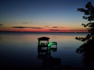 A picuture of a dock on the Choctawhatchee Bay before sunrise